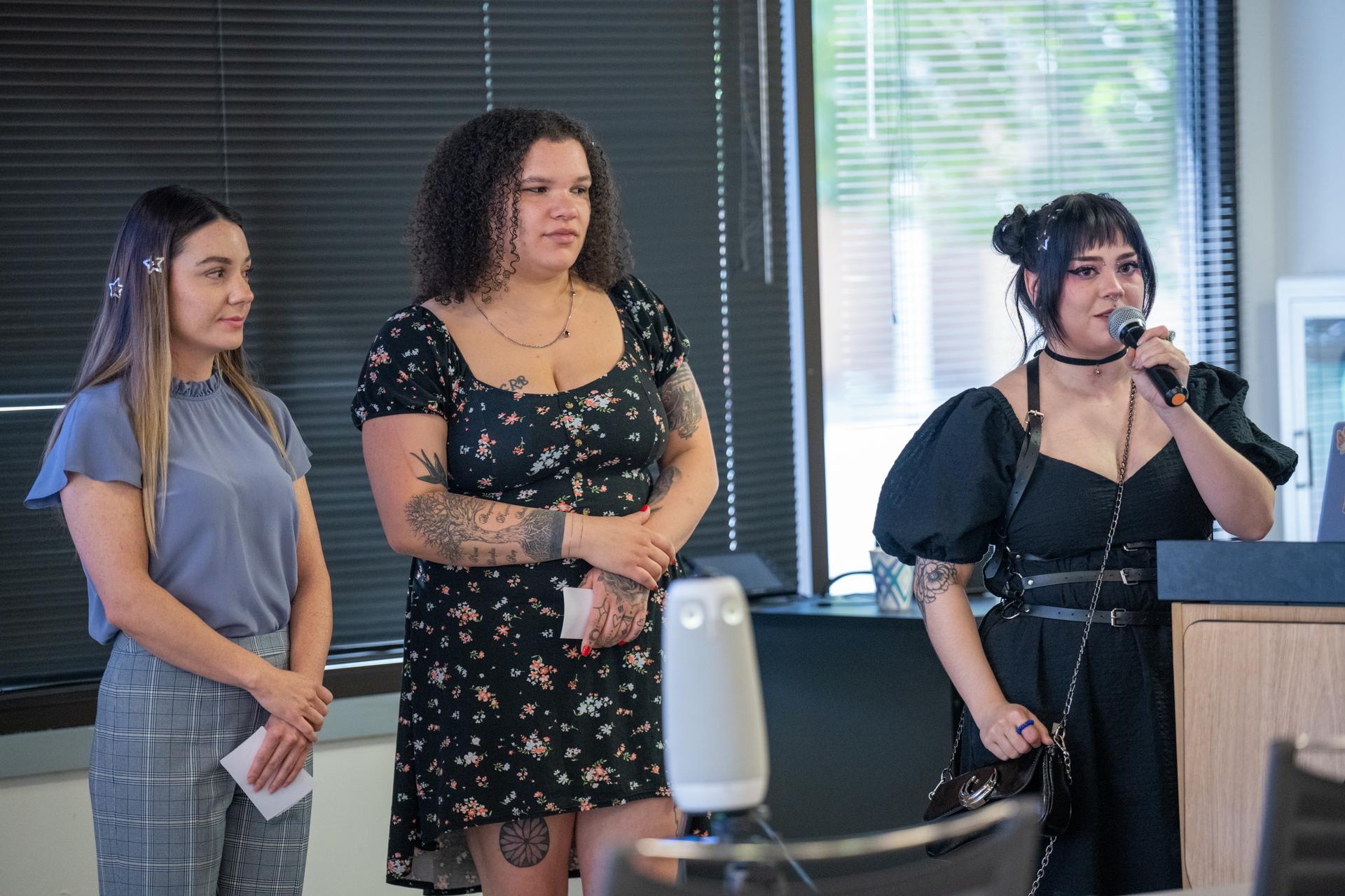 Three Deep Dive students presenting their Capstone projects at Demo Day 2024.