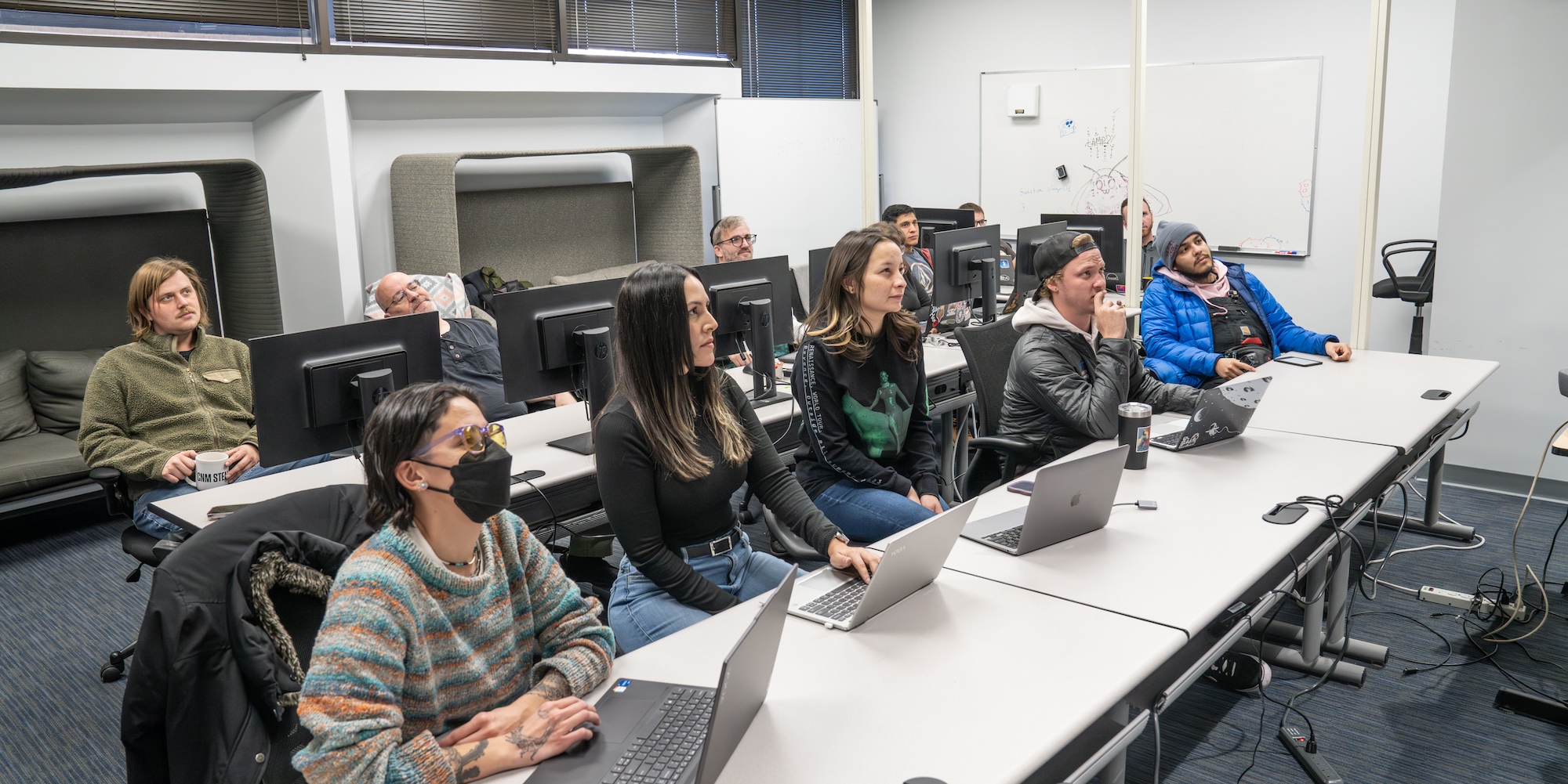 Deep Dive students listening to a lecture about ServiceNow system administration